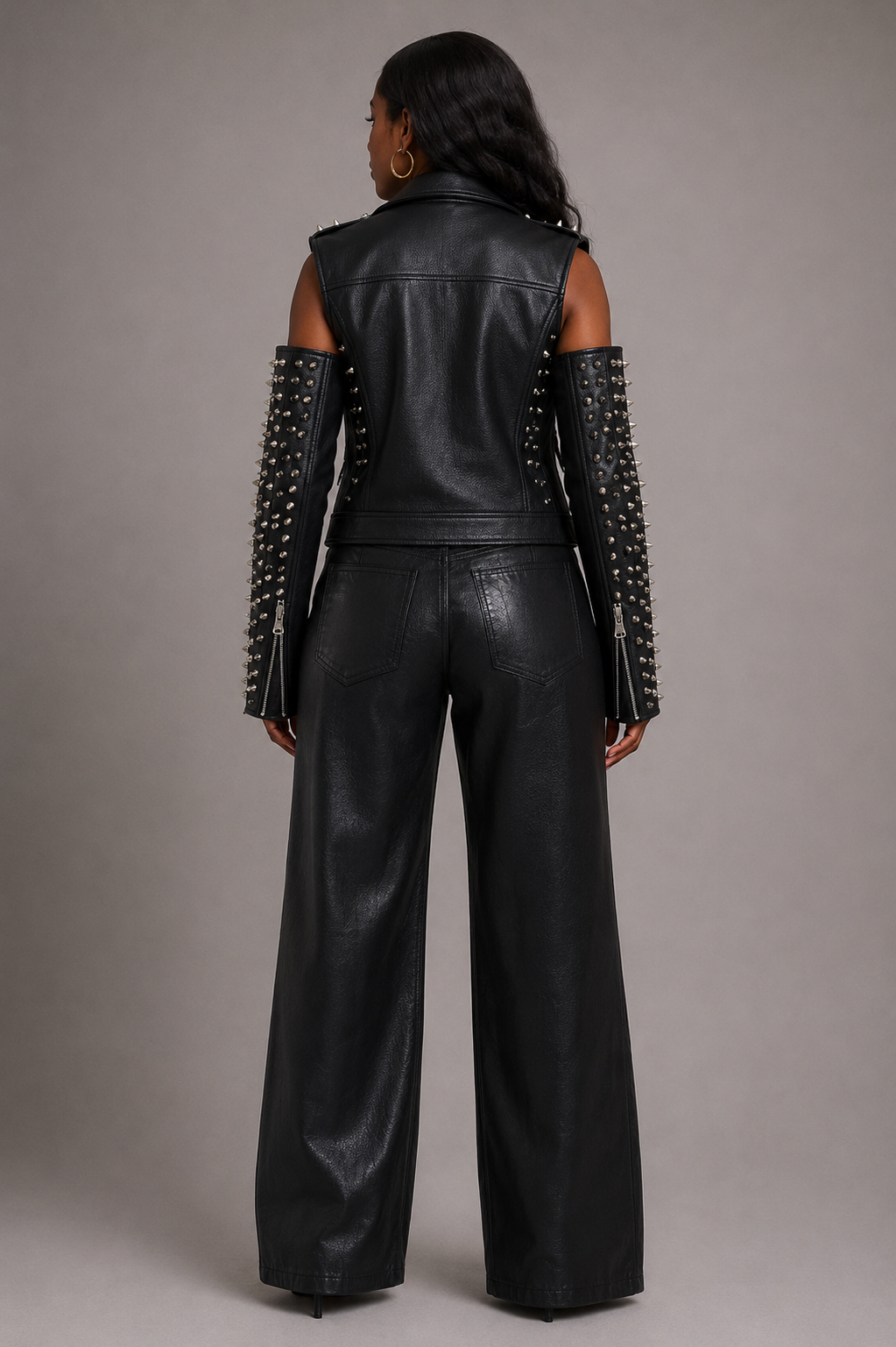 Black/SILVER studded pleather moto jacket with open shoulder cutouts shown from the BACK, featuring an edgy fitted silhouette styled with distressed denim by For Her NYC