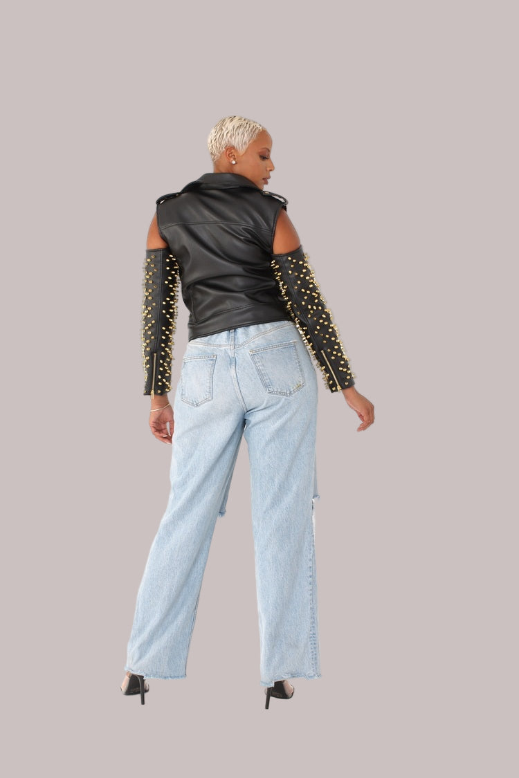 Black/Gold studded pleather moto jacket with open shoulder cutouts shown from the back, highlighting studded sleeve detail and edgy silhouette by For Her NYC