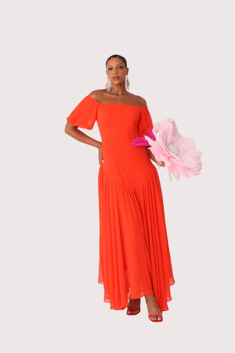 Red off-shoulder maxi dress shown front view with scarf accent in motion, statement styling, For Her NYC