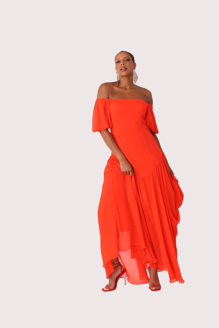 Red off-shoulder maxi dress shown in side profile highlighting movement and drape, For Her NYC