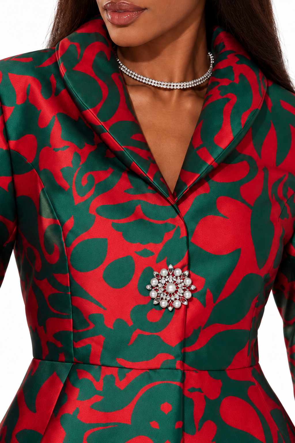 Close-up of a model wearing the Tally Taylor Abstract Print Jacket and Midi Skirt Set - U0109, highlighting the padded collar, abstract print, and jeweled brooch