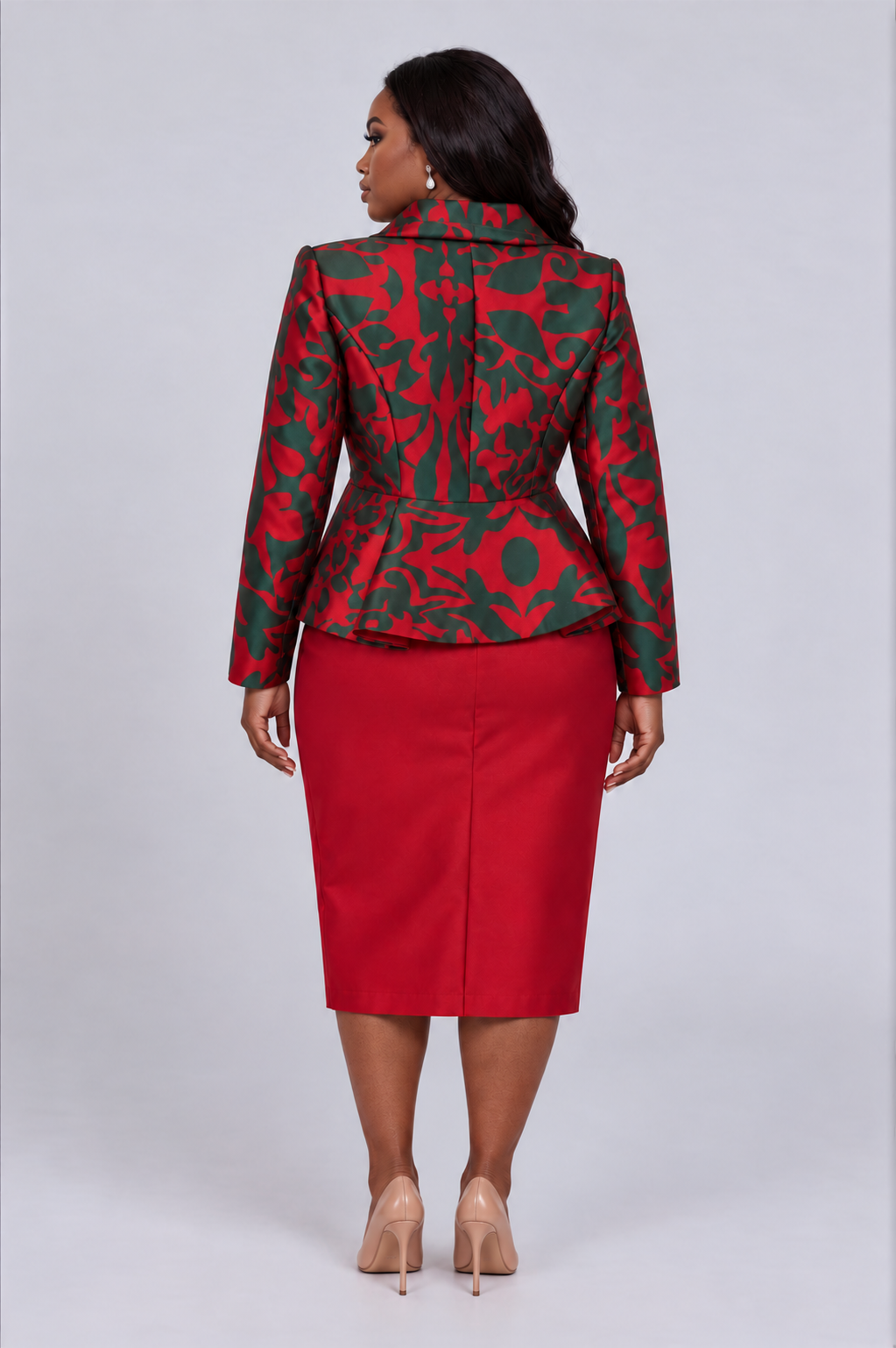 Back view of a plus size model wearing the Tally Taylor Abstract Print Plus Size Jacket and Midi Skirt Set - U0109W, highlighting the peplum silhouette