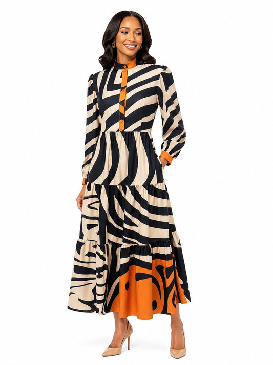 Model wearing the Tally Taylor Wavy Graphic Print Tiered Maxi Dress in black, multi colors, featuring a bold abstract print and tiered skirt, style S0267