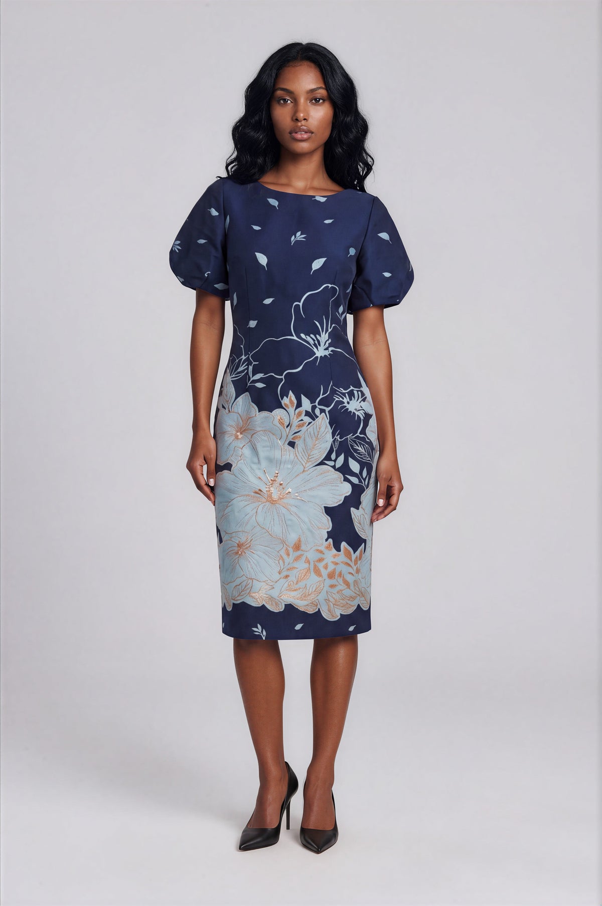 Front view of a model wearing the twilight blue Tally Taylor Floral Puff Sleeve Sheath Dress - 9869 with light blue floral graphics and metallic-toned accents