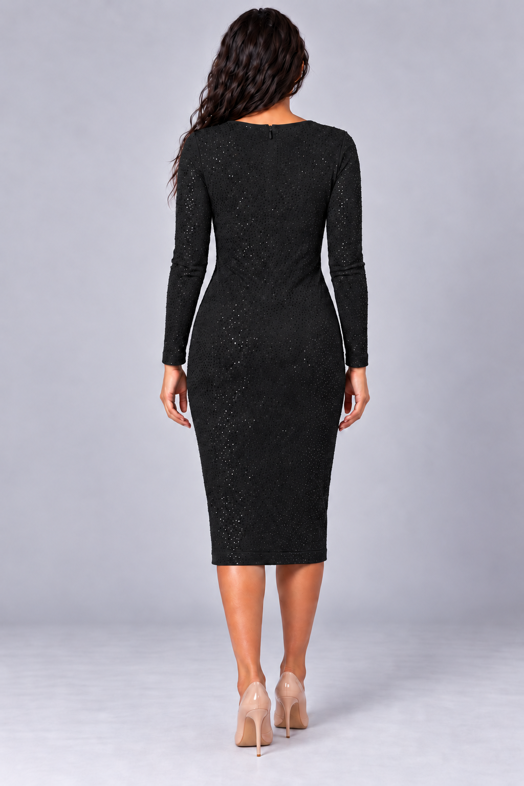 Back view of a model wearing the black Tally Taylor Glimmer Sheath Dress - 5388 with long sleeves, a back zipper, and allover sparkling embellishments