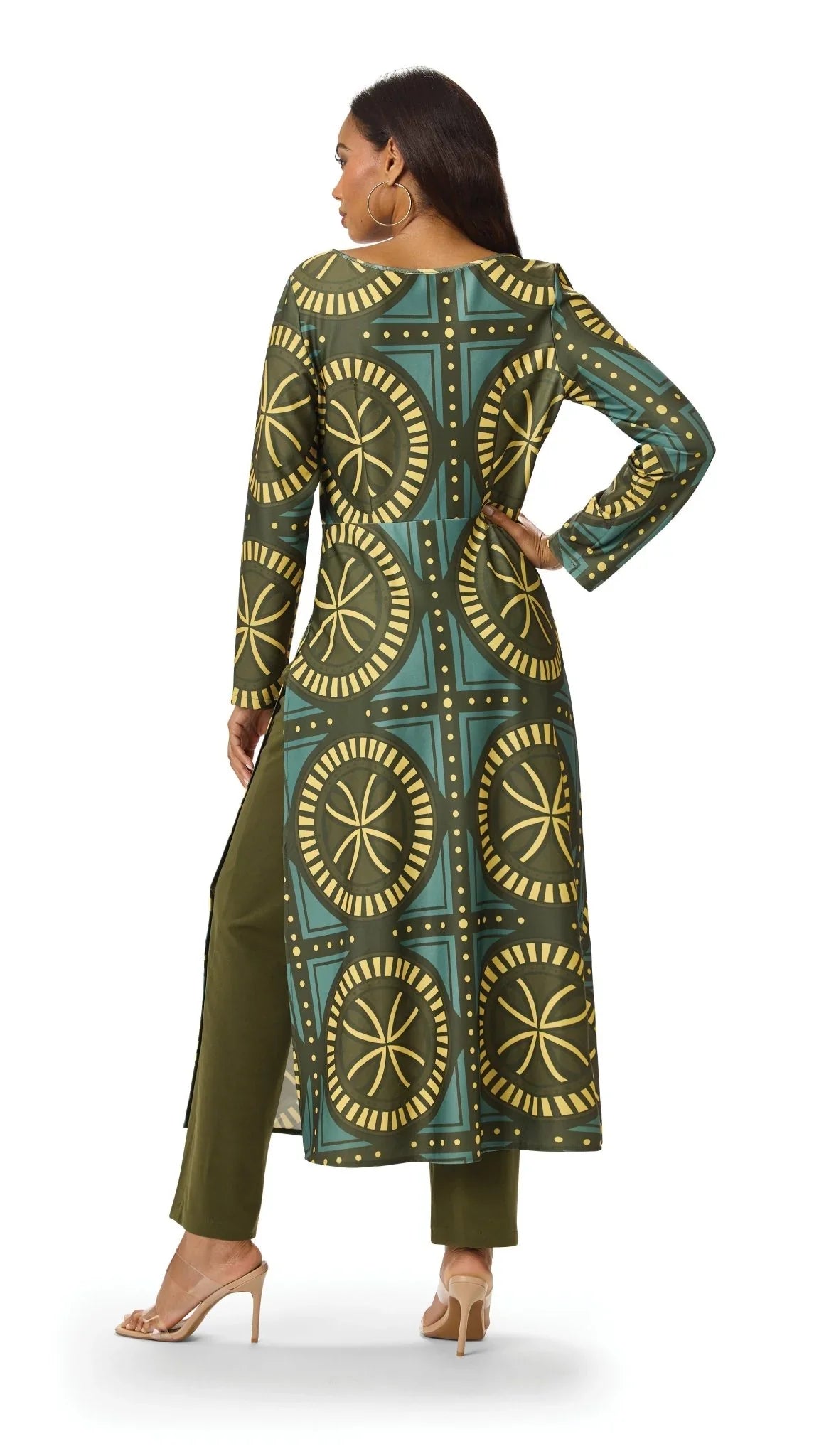 Model showing the back of the Tally Taylor Geo Circle Print Long Tunic Pant Set in olive green, featuring a bold geometric print and coordinating pants, style S0274.