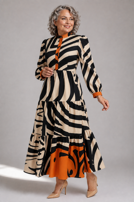 Plus size model wearing the Tally Taylor Wavy Graphic Print Tiered Maxi Dress in black, multi colors, featuring a bold abstract print and tiered skirt, style S0267W