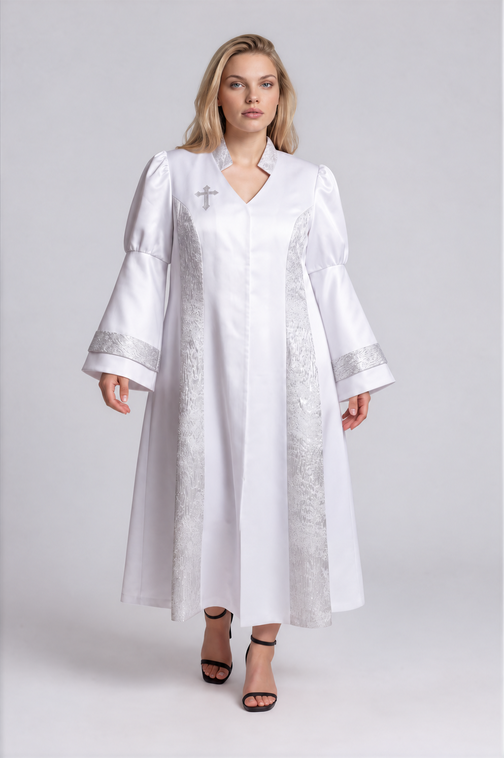 Front view of a plus-size model wearing the white and silver Tally Taylor Plus Size Contrast Panel Bell Sleeve Clergy Robe - 4565W with patterned panels, bell sleeves and a cross detail