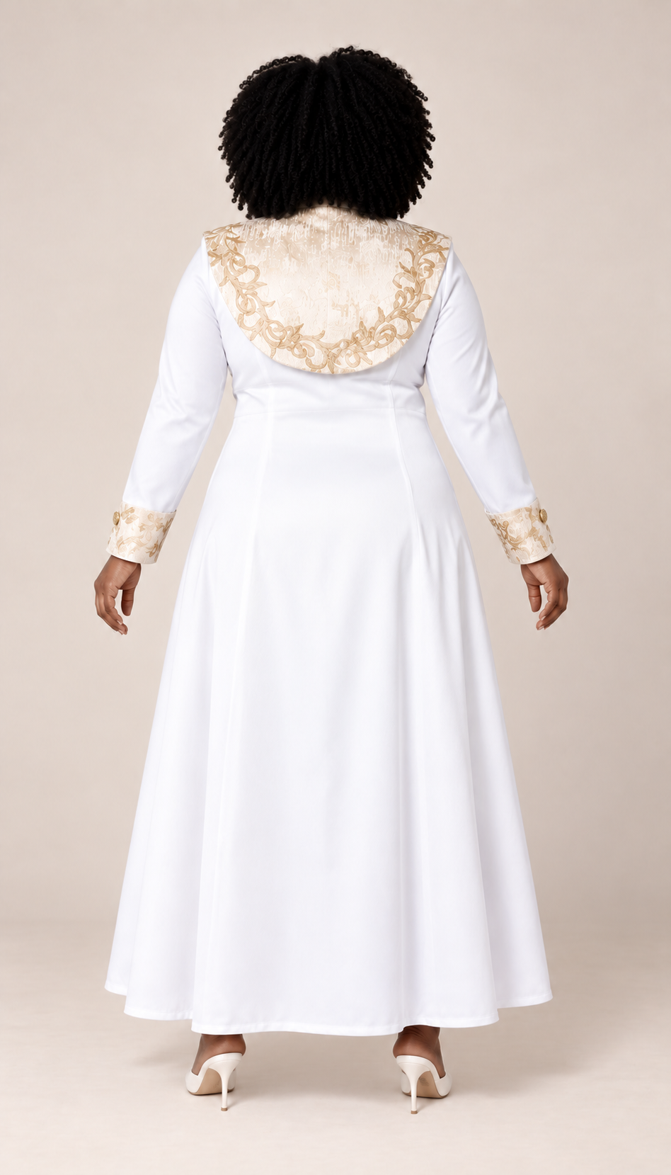 Back view of a plus-size model wearing the white Tally Taylor Plus Size Embroidered Clergy Midi Dress - 41093W with a gold embroidered back yoke and matching cuffs