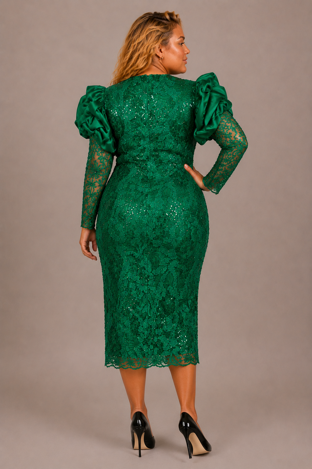 Plus size model showing the back of the Tally Taylor Sequin Lace Puff Sleeve Midi Dress in green, featuring floral sequin lace, statement satin puff sleeves, and back zipper, style S0063W.