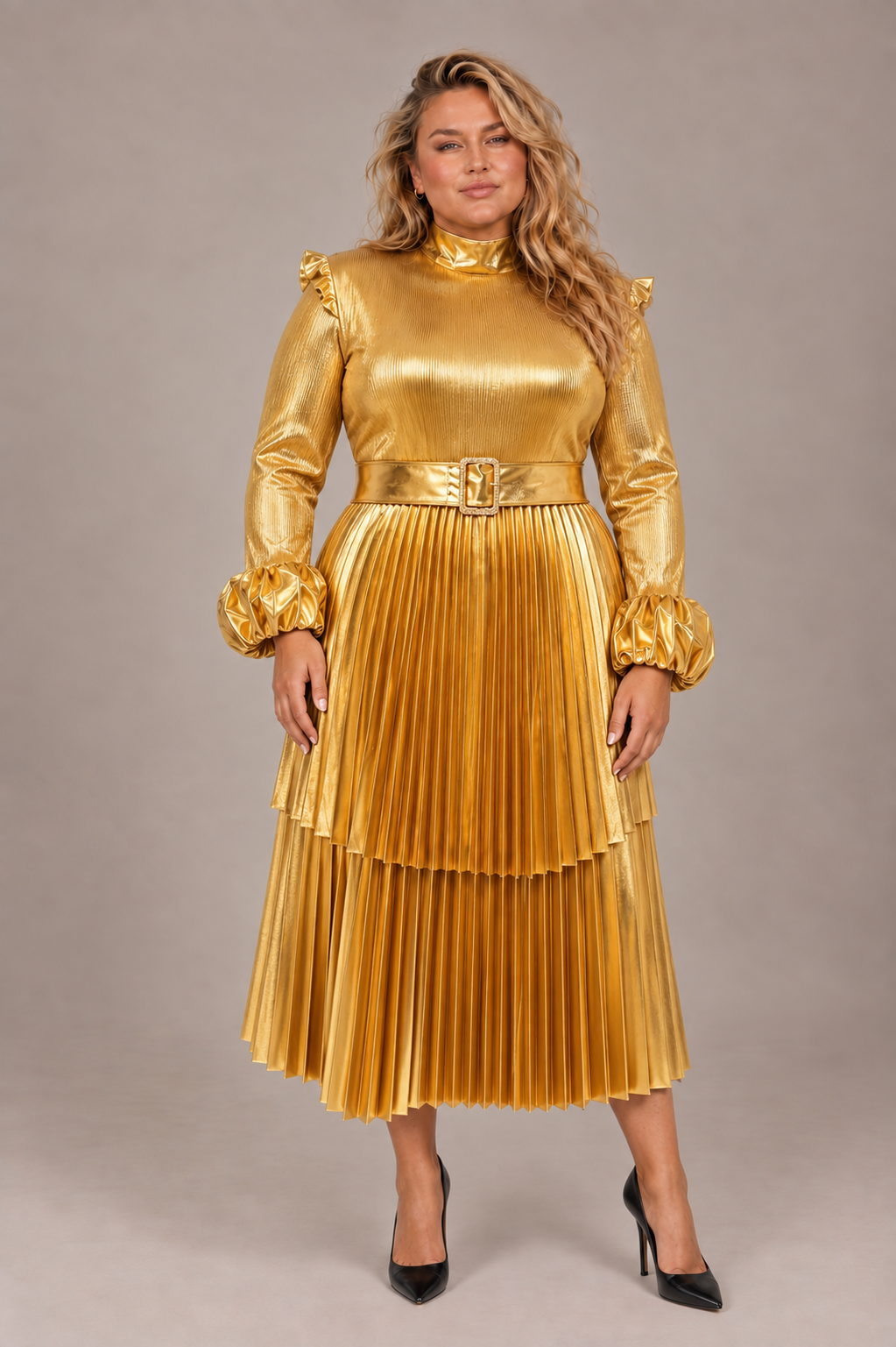 Front view of a plus-size model wearing the metallic gold Tally Taylor Pleated Statement Midi Dress - S0276W with a belted waist, high neckline, long sleeves, and tiered pleated skirt