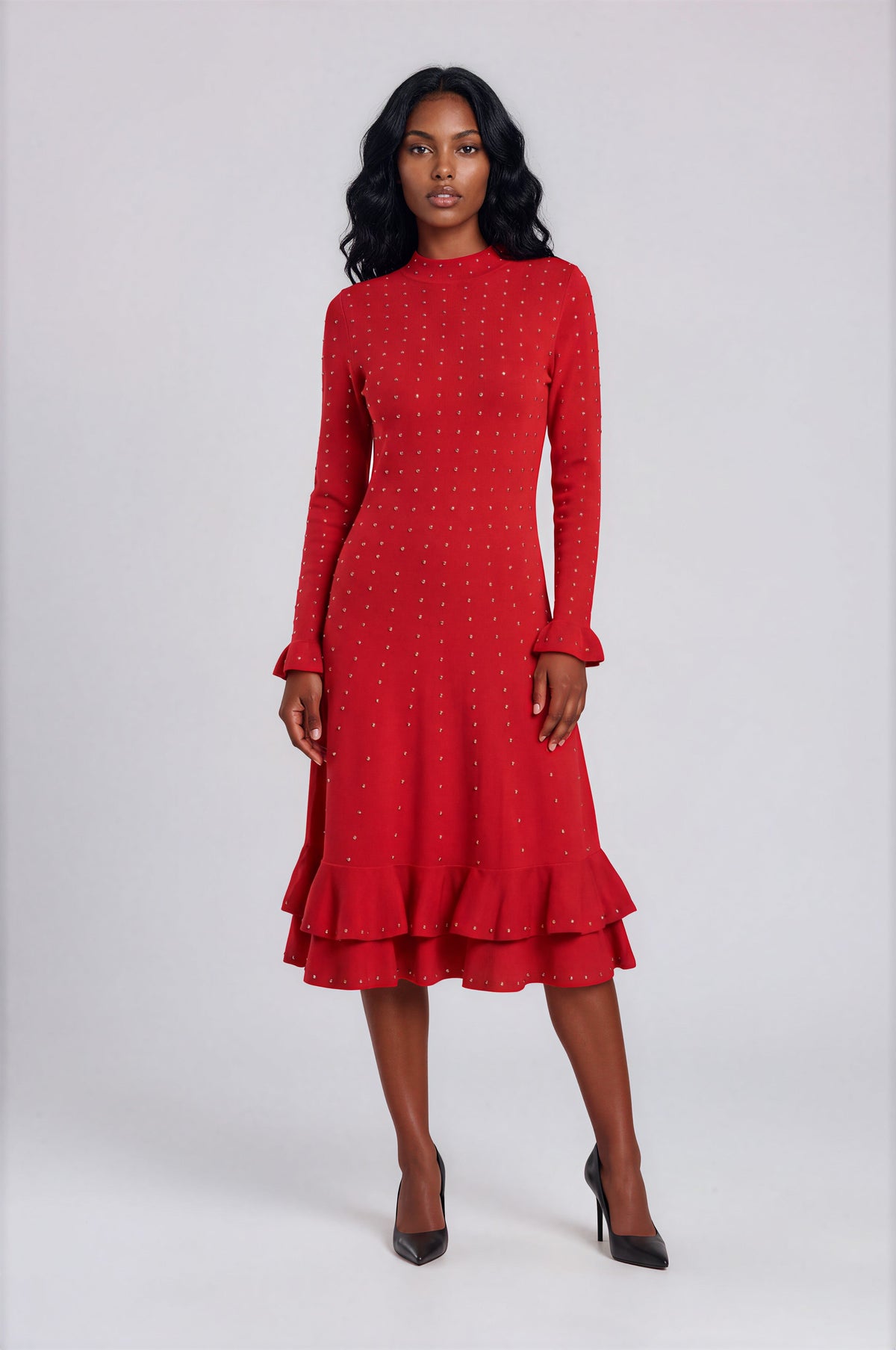 Front view of a model wearing the red and gold Tally Taylor Rhinestone Knit Ruffle Hem Midi Dress - 5405, featuring rhinestone embellishments and a ruffled hem