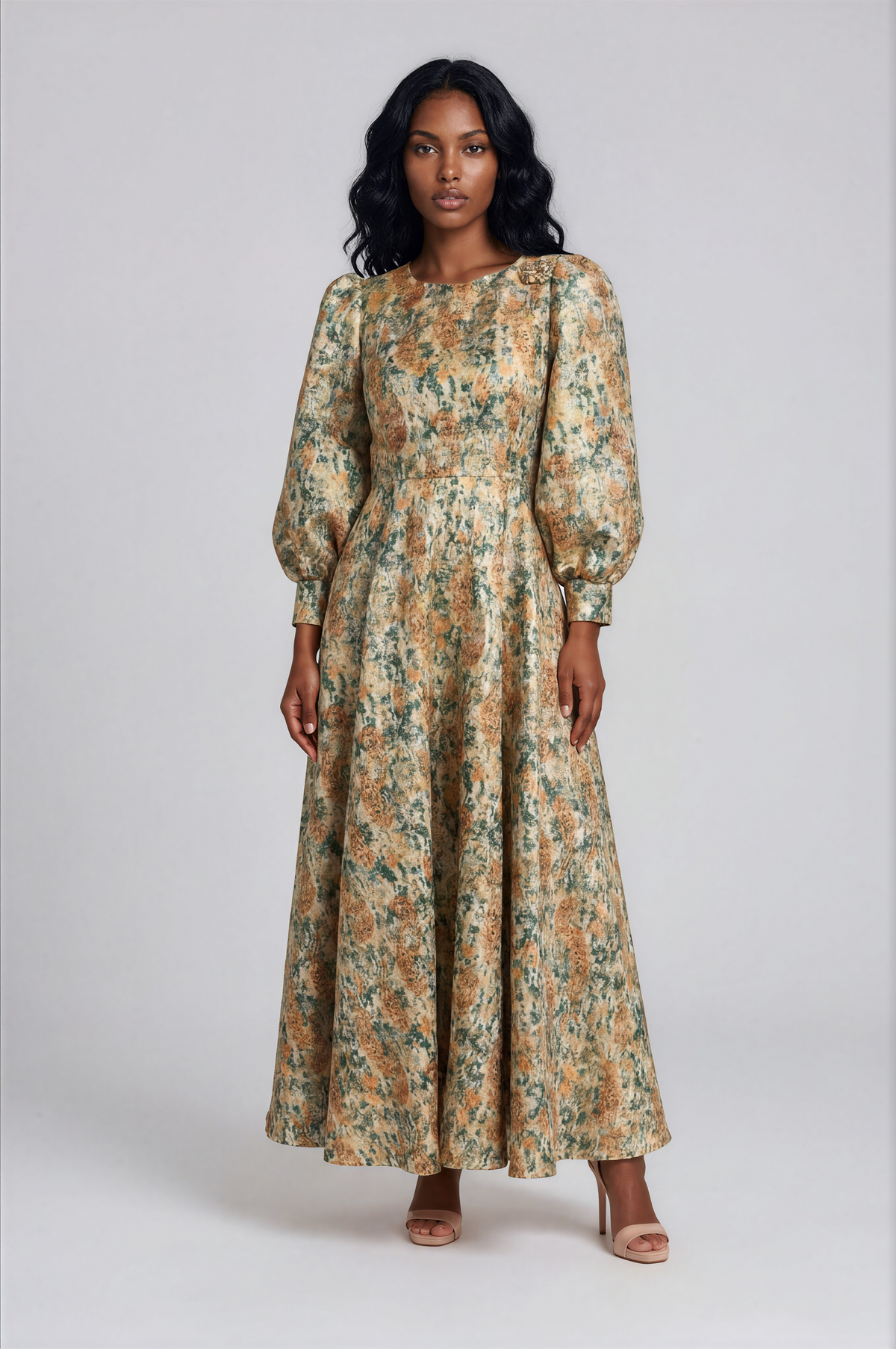 Tally Taylor turquoise and gold floral brocade maxi dress featuring bishop sleeves, a round neckline, and a decorative brooch.