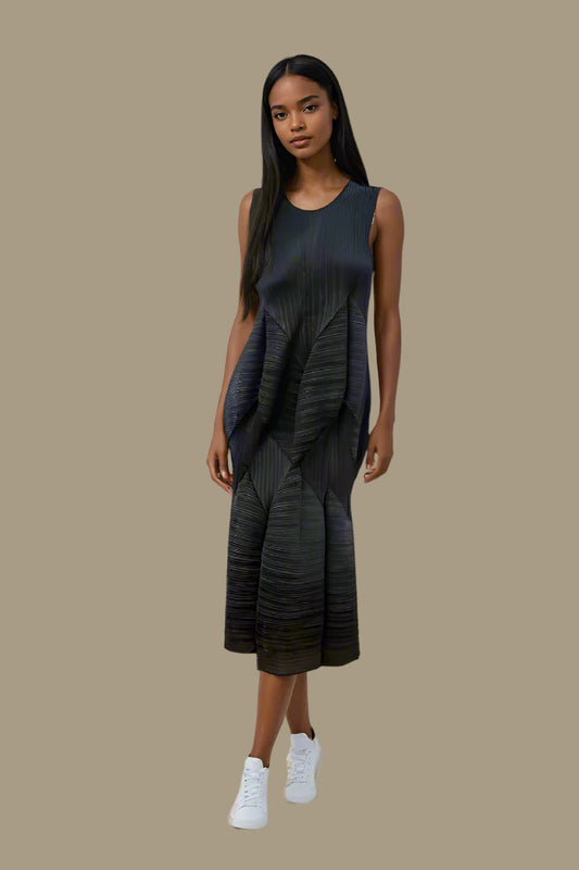 Model wearing the black textured wave sleeveless dress walking forward, showcasing pleated wave texture and fluid midi silhouette by For Her NYC