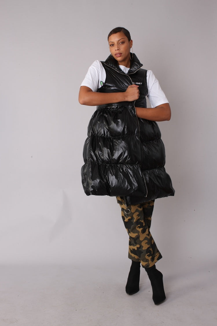 Front view of black tiered puffer vest styled with matching pants — For Her NYC.
