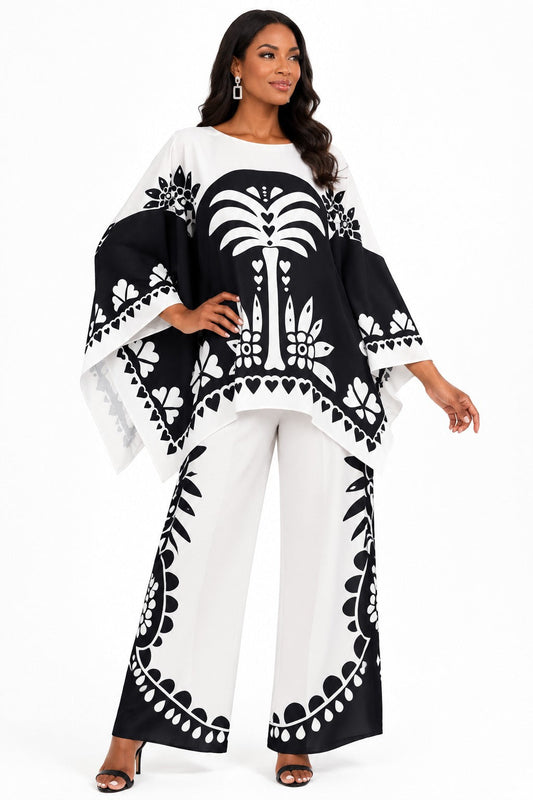 For Her NYC Black & White Maxi Tunic Pant Set featuring a bold monochrome print, flowing maxi tunic with wide sleeves, coordinating wide-leg pants, and an elegant two-piece silhouette.