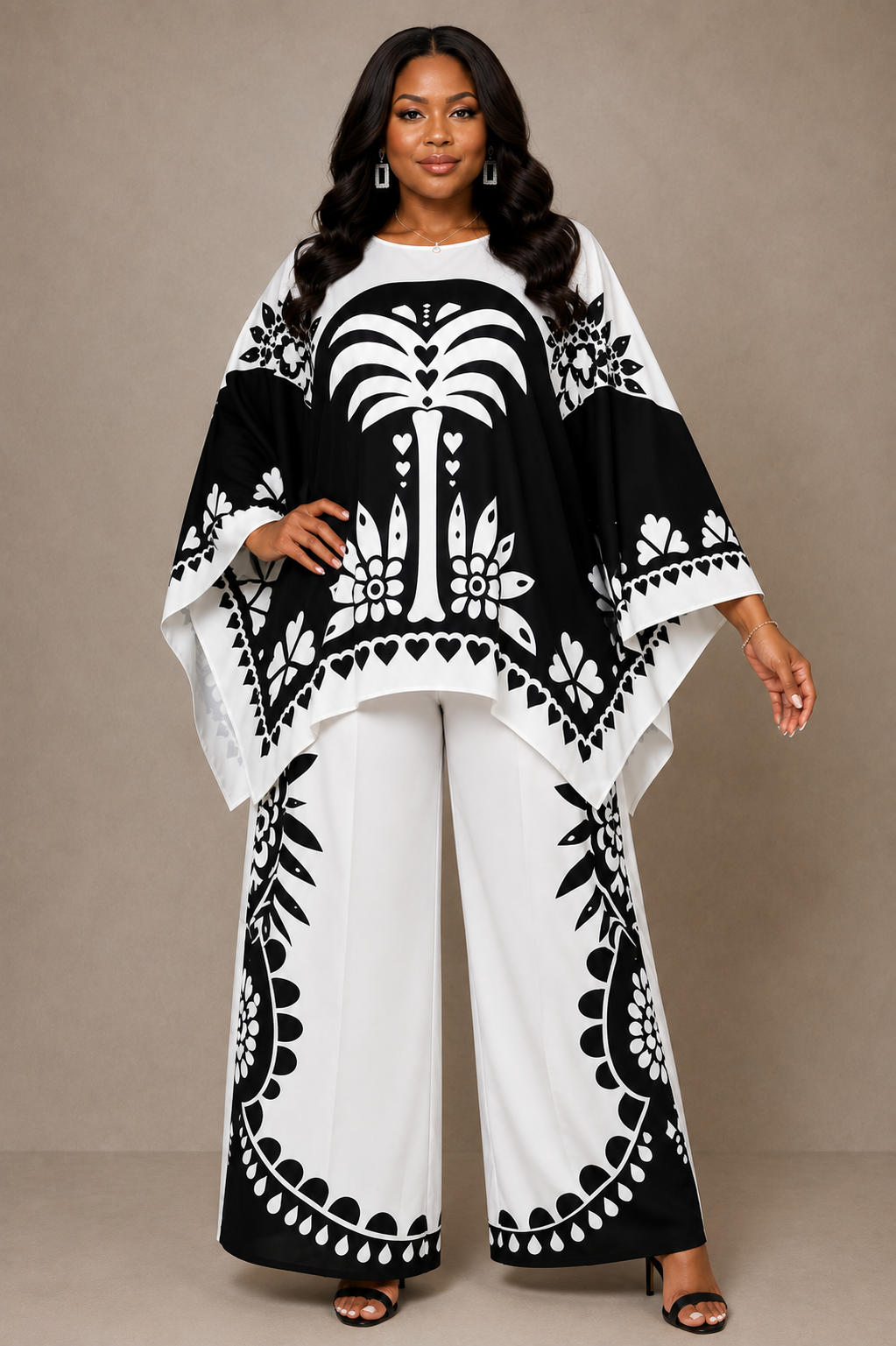 For Her NYC Plus Size Black & White Maxi Tunic Pant Set featuring a bold monochrome print, flowing maxi tunic with wide sleeves, coordinating wide-leg pants, and a flattering relaxed two-piece silhouette.