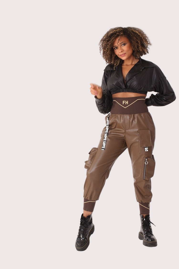 Front view of brown vegan leather cargo joggers with elastic waistband and structured silhouette, modern streetwear look, For Her NYC