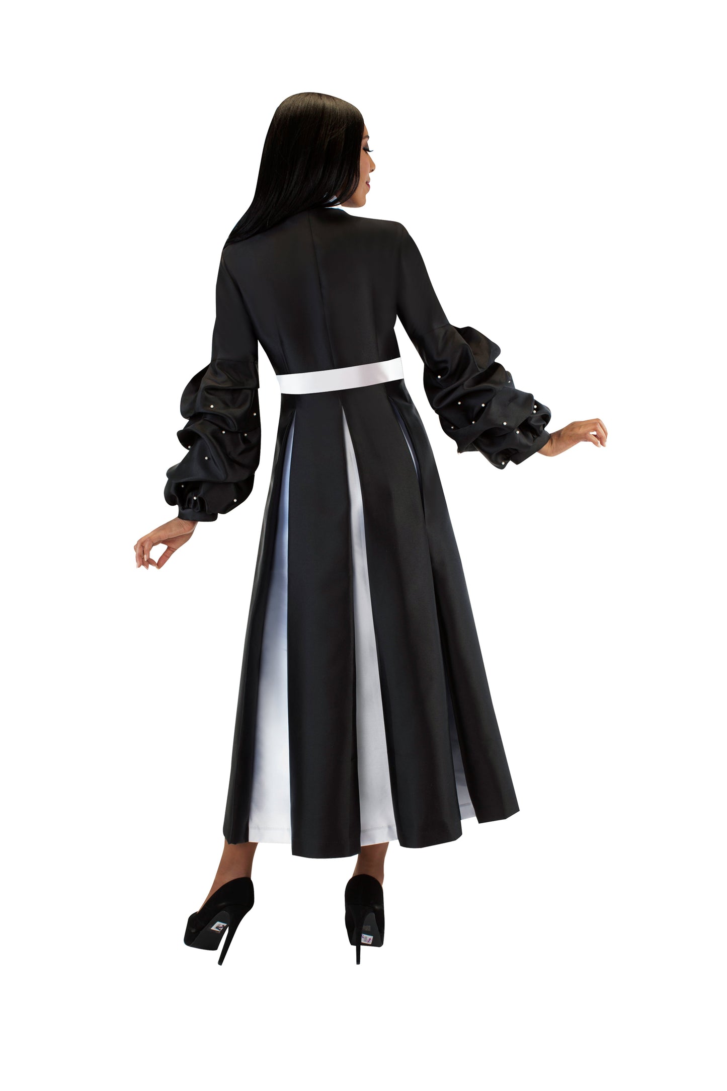 Black women's modern cassock robe with bishop sleeves and pearl accents, model walking away back view — Tally Taylor