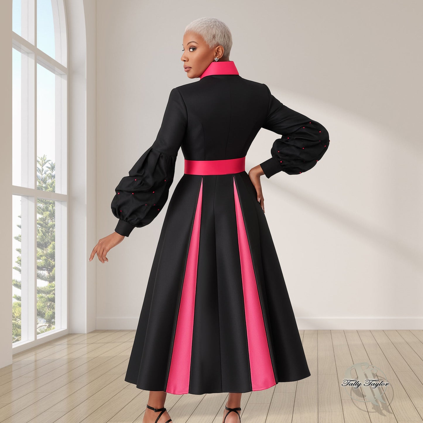 Black women's modern cassock robe with fuchsia trim panel and bishop sleeves, model back view with arm extended — Tally Taylor