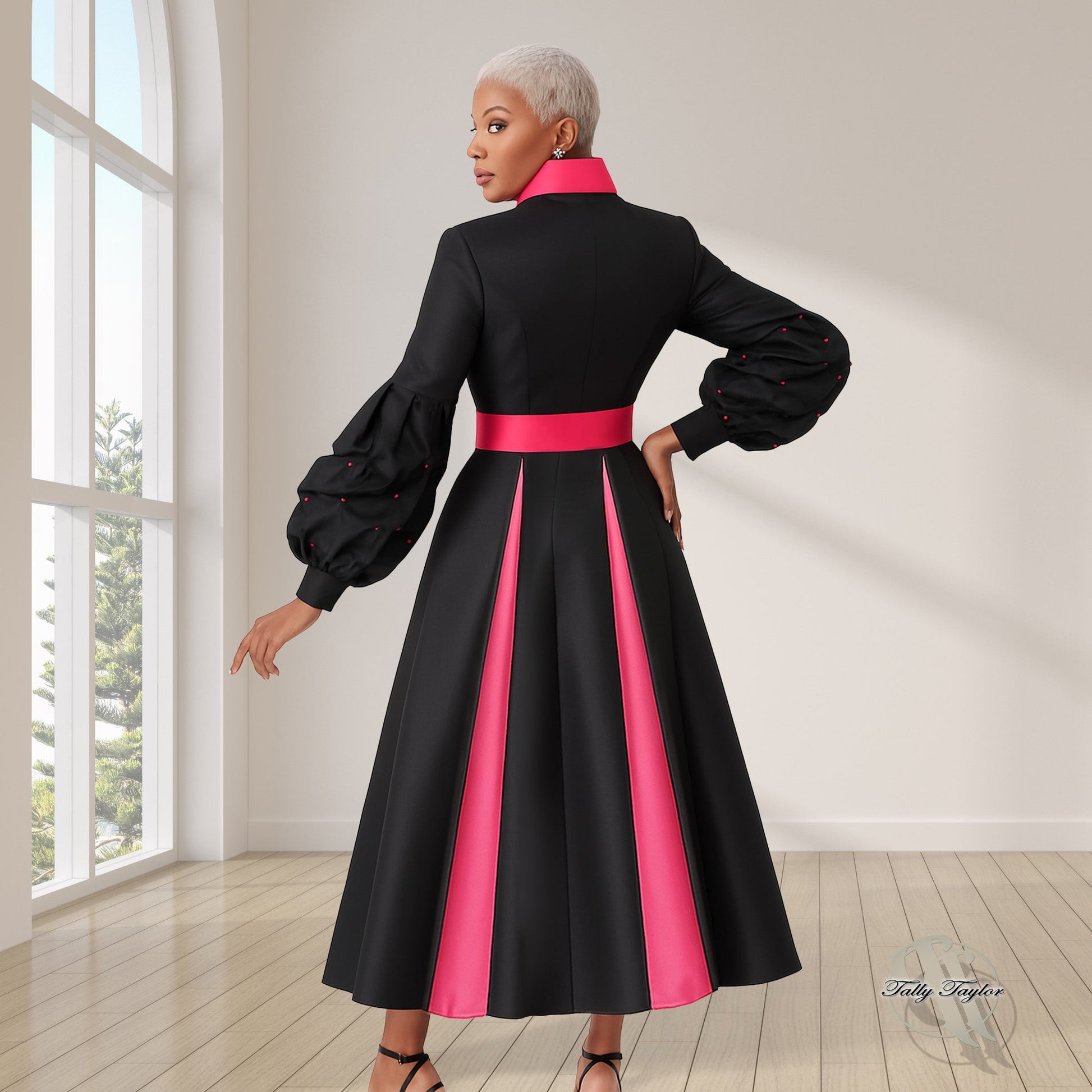Black women's modern cassock robe with fuchsia trim panel and bishop sleeves, model back view with arm extended — Tally Taylor