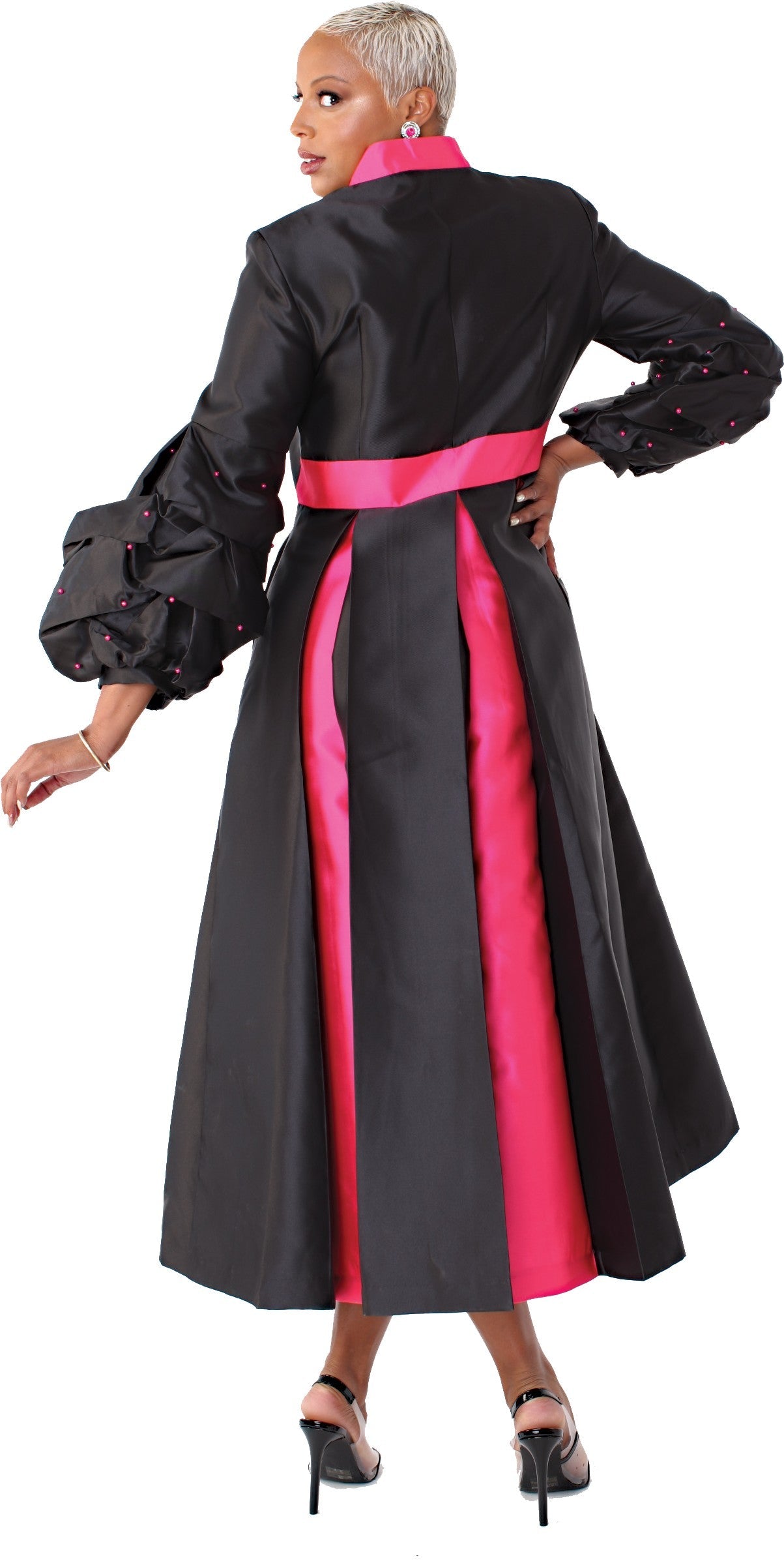 Black plus size modern cassock robe with fuchsia trim panel and bishop sleeves, model back view standing — Tally Taylor